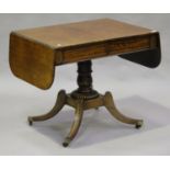 A Regency mahogany and brass inlaid sofa table with ebony stringing and oak-lined drawers, height
