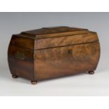 A Regency mahogany tea caddy of curved sarcophagus form with overall ebony stringing and brass