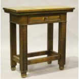 A 20th century French oak side table, fitted with a single frieze drawer, the block legs carved with