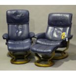 A pair of modern Stressless blue leather reclining armchairs and matching footstools by Ekornes,