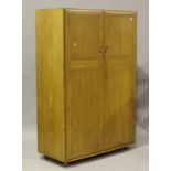 An Ercol elm wardrobe, fitted with two doors enclosing hanging space, height 183cm, width 122cm,