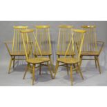 A set of six Ercol pale elm stick back dining chairs, comprising two carvers and four standards,