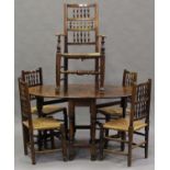 A harlequin set of five late 19th and early 20th century ash spindle back dining chairs with rush