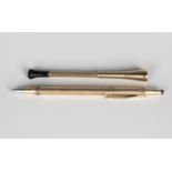 A 9ct gold mounted cigarette holder with banded decoration and black plastic mouthpiece,