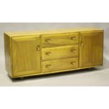 An Ercol elm sideboard, fitted with drawers and cupboards, height 68cm, width 156cm, depth 43cm,