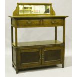 An Edwardian oak two-tier buffet, the mirror back above two drawers and two doors, height 150cm,
