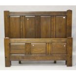 A modern 18th century style solid oak panelled double bed frame by Bylaw, height 136cm, length