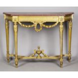 A 20th century Neoclassical Revival giltwood console table with a rouge marble top above carved