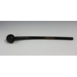An African hardwood knobkerrie with curved shaft and bulbous head, length 49cm.Buyer’s Premium 29.4%