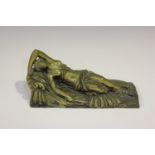 A late 19th/early 20th century Continental gilt bronze figure of a recumbent Classical female,