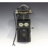 An early 20th century Swedish black enamelled and nickel mounted wall telephone by L.M. Ericsson,