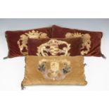 A group of four velvet cushions, purportedly made for the 1953 coronation and applied with 17th