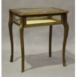 A 20th century walnut and gilt metal mounted bijouterie table, height 78cm, width 70cm, depth 51cm.