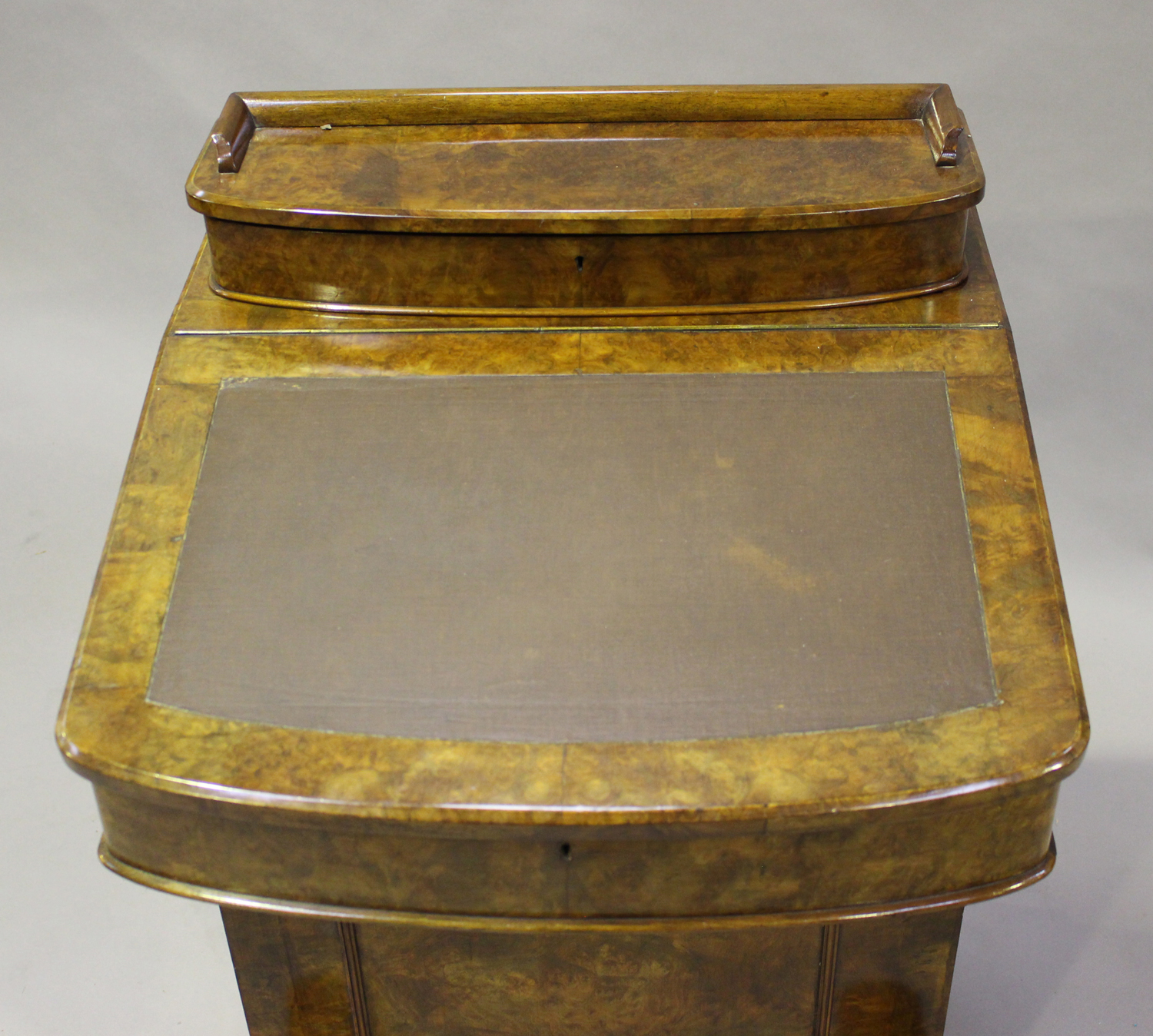 A late Victorian burr walnut Davenport, fitted with a hinged pen compartment and writing slope above - Image 8 of 8