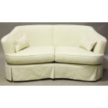 A pair of modern cream fabric tub back sofas by Multiyork, fitted with tailored removable covers,