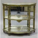 A mid-19th century French giltwood and gesso three-tier console display table, inset with mirrored