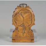 A late 19th/early 20th century Swiss Black Forest carved softwood watch case, finely modelled with