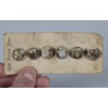A set of six early 20th century gentleman's dress buttons, each inset with a print of a cricketer,