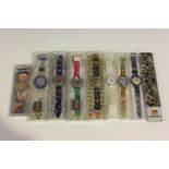 A group of eight Swatch wristwatches, including a Pop Swatch and an Atlanta 1996 example.Buyer’s