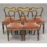 A set of nine early Victorian mahogany spoon back dining chairs and a later made copy, all with pink