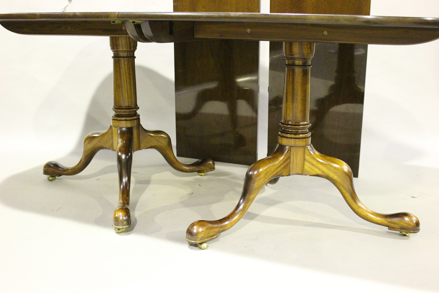 A late 20th century George III style mahogany twin-pedestal dining table, the top with two extra - Image 2 of 3