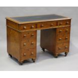 A Victorian mahogany twin-pedestal campaign desk, possibly naval, the top inset with gilt tooled