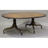 A George III and later mahogany 'D' end twin-pedestal dining table, the top inlaid in ebony with a