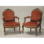 A pair of late 19th century French rosewood showframe salon armchairs with finely carved top rails