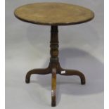 A late George III mahogany circular tip-top wine table, raised on tripod legs, height 71cm, diameter