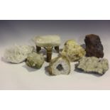 A selection of seven mineral specimens, including various quartz, a quartz geode and a formation