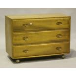 An Ercol elm chest of three drawers, height 66cm, width 91cm, depth 43cm, together with an Ercol