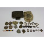 A Christmas 1914 Princess Mary gift tin, together with a collection of military and other badges and
