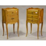 A pair of 20th century French kingwood bedside chests with raised galleries and brass handles,