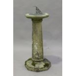 A 20th century cast composition stone garden sundial stand, the cast alloy dial above an octagonal