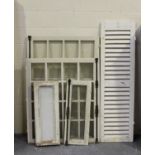 A pair of early 20th century French white painted windows, each panel 89cm x 33cm, together with two