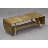 An Ercol drop-flap coffee table, with spindle undertier, height 36cm, extended length 160cm, depth