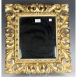 An early 20th century Florentine giltwood rectangular wall mirror, 51cm x 46cm.Buyer’s Premium 29.4%