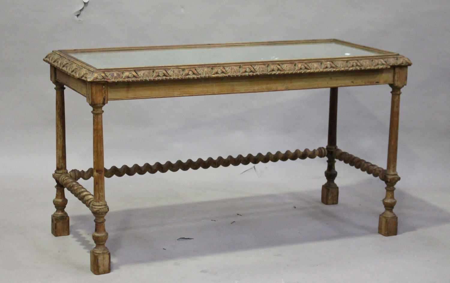 A late 19th century pitch pine rectangular hall table, the top inset with a mirror panel within an