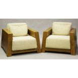 A pair of modern elm armchairs by Maxxa, with angular frames and loose cushions, height 56cm,