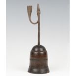 A wrought iron combination rush light candle holder, probably 17th century, mounted on a patinated