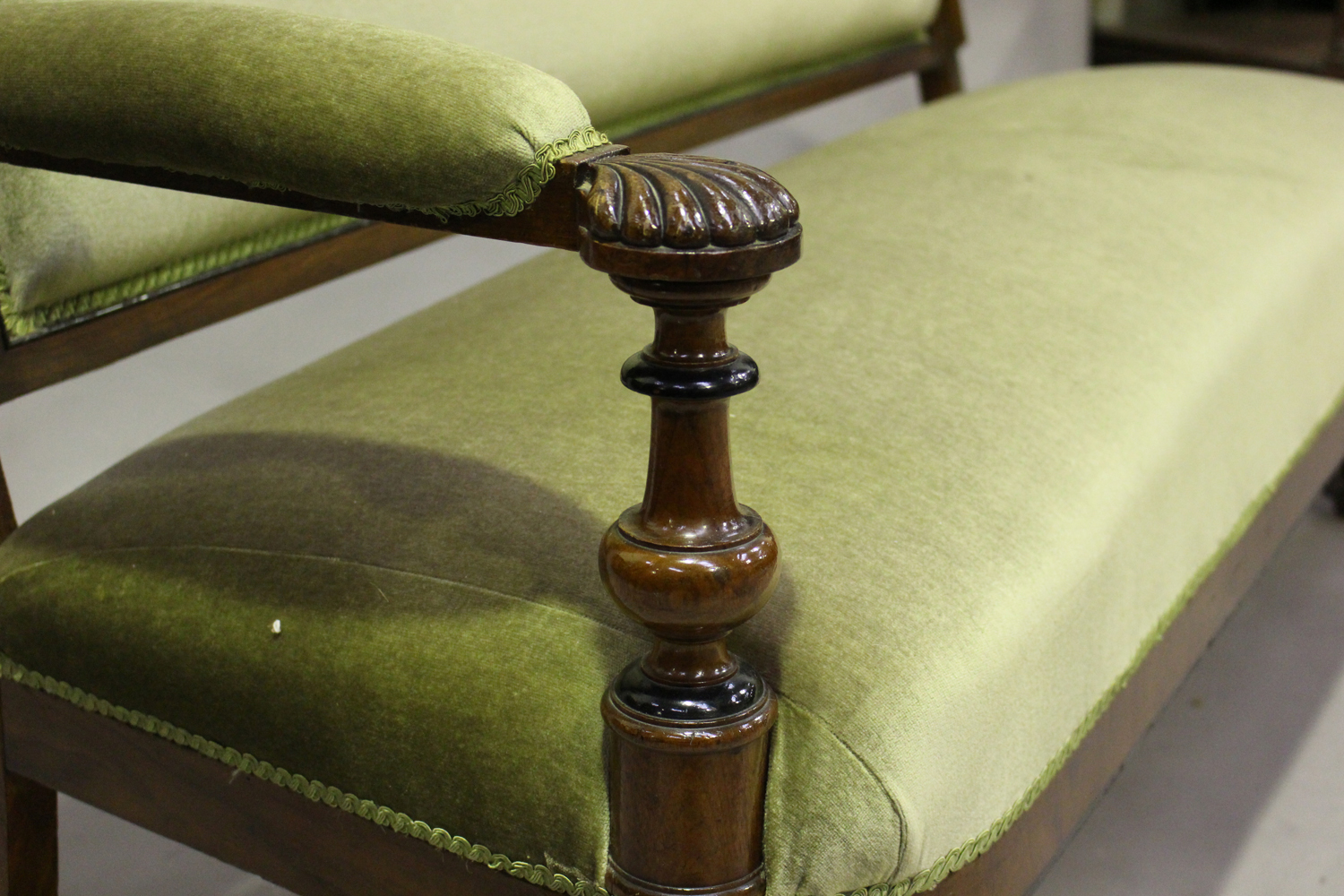 A late Victorian burr walnut showframe settee with ebonized banding, the handrests carved with - Image 4 of 4