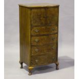 An early 20th century burr walnut bowfront tallboy, fitted with four oak-lined drawers, on