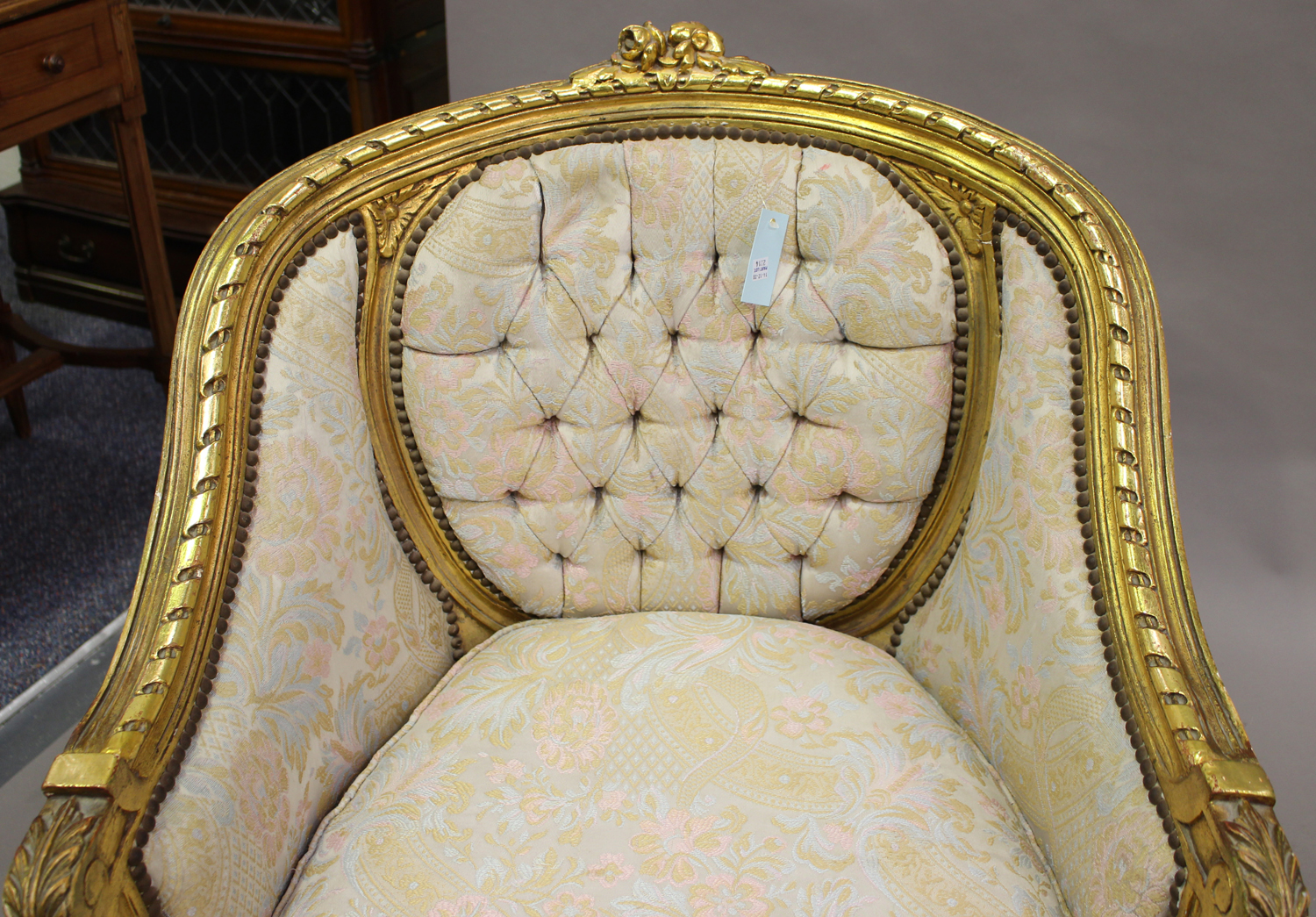 A pair of 20th century Louis XVI style giltwood showframe tub back armchairs, upholstered in foliate - Image 5 of 5