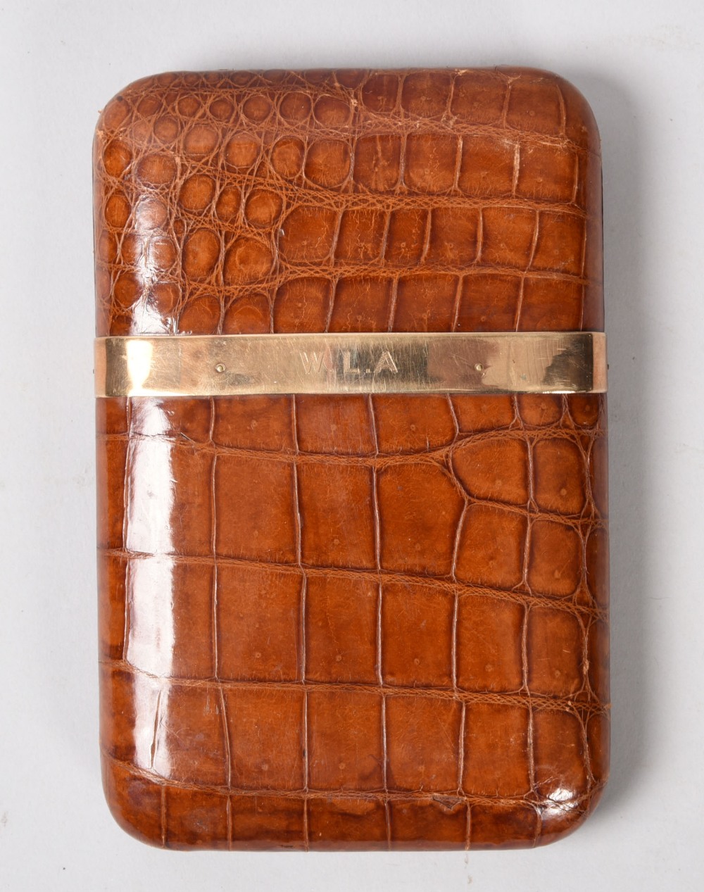 An early 20c brown crocodile skin cigar box fitted for five, manufactured by John Pound & Co Ltd,