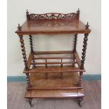 A Victorian burr walnut whatnot Canterbury, the upper table top wit satin wood line inlaid and