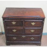 A mid 18c oak country bureau with fall front, the interior fitted with six simple drawers with a
