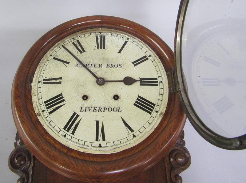 A late Victorian walnut and oak striking drop dial wall clock, the circular bezel with white painted - Image 2 of 4