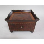 A late Georgian mahogany tray top desk tidy, inlaid and crossbanded, having one drawer and supported