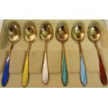 An early 20c boxed set of six gilt sterling silver and enamel coffee spoons, in original box.