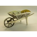 An Edwardian period Indian silver novelty wheelbarrow, the base named Krishnah Chetty Bangalore. The